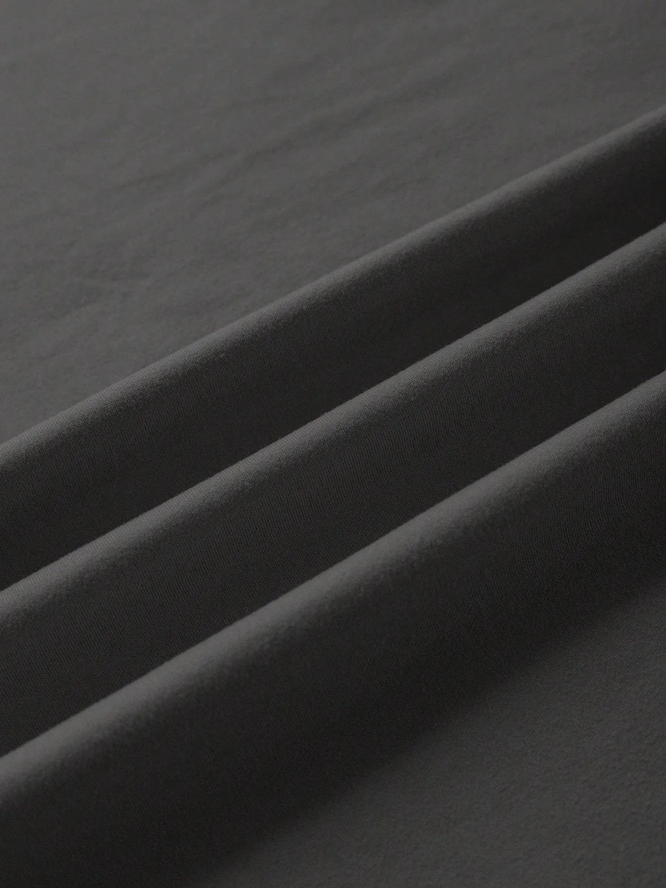 A loose, straight-cut cotton T-shirt for men and women in various colours.