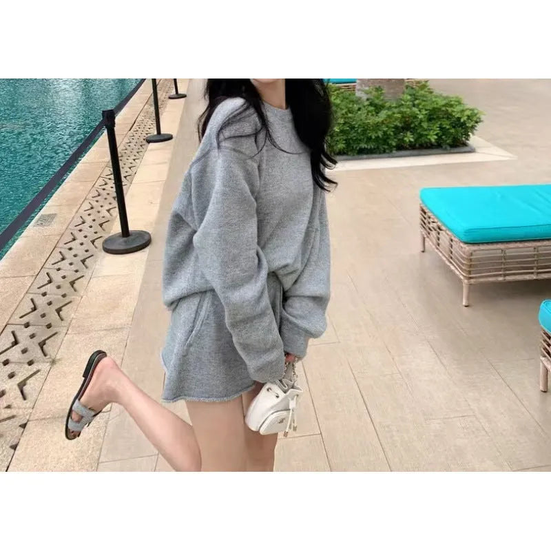 Women’s loose-fitting knitted set with long sleeve sweater and shorts in dark gray