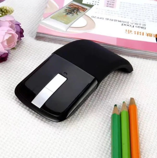 Folding Bluetooth 4.0 touch wireless mouse shown in unfolded position with dimensions 131.2 x 55 x 14.5 mm
