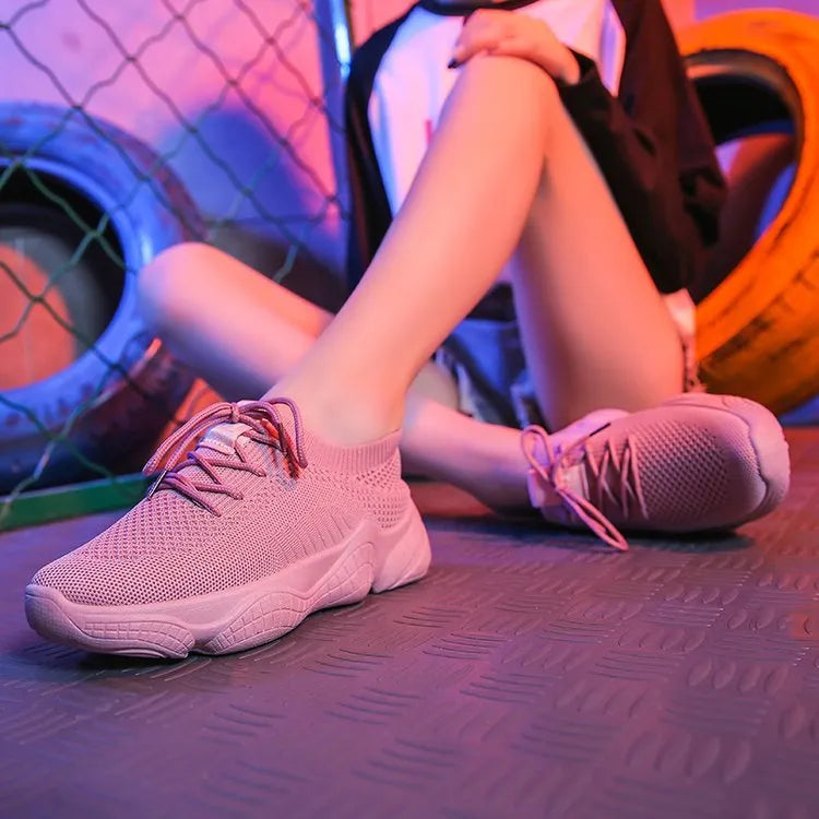 Women's white thick-soled sports shoe with woven upper and front strap