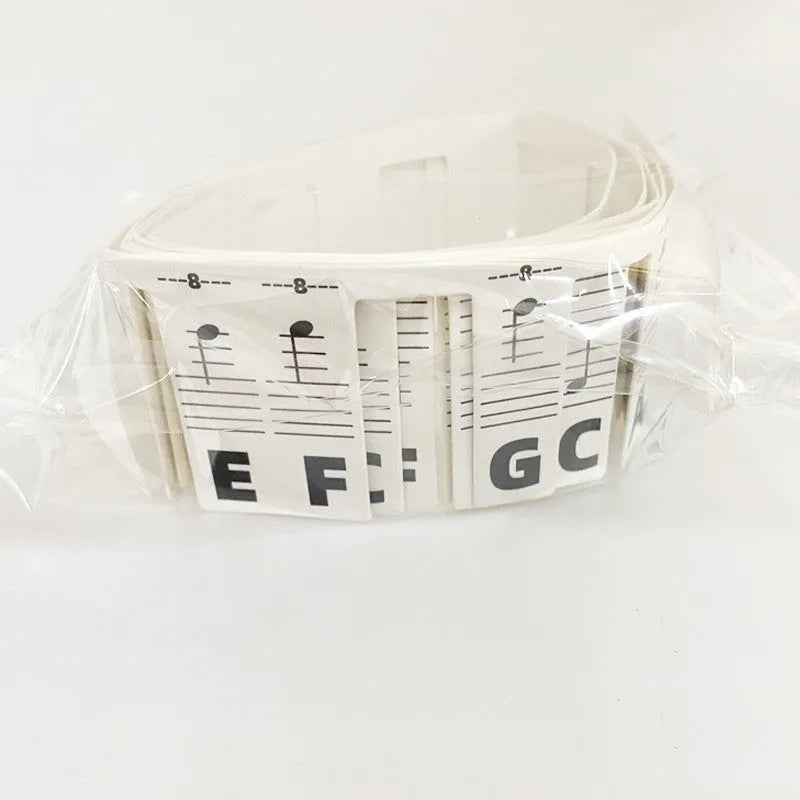 Piano keyboard note stickers on white card for 88-key pianos showing colour bars and black notation