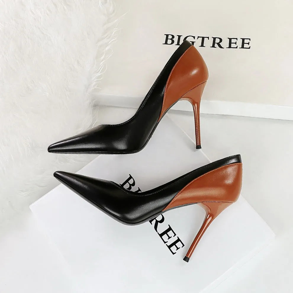 Women's black retro stiletto high heel pumps with pointed toe and super high heel