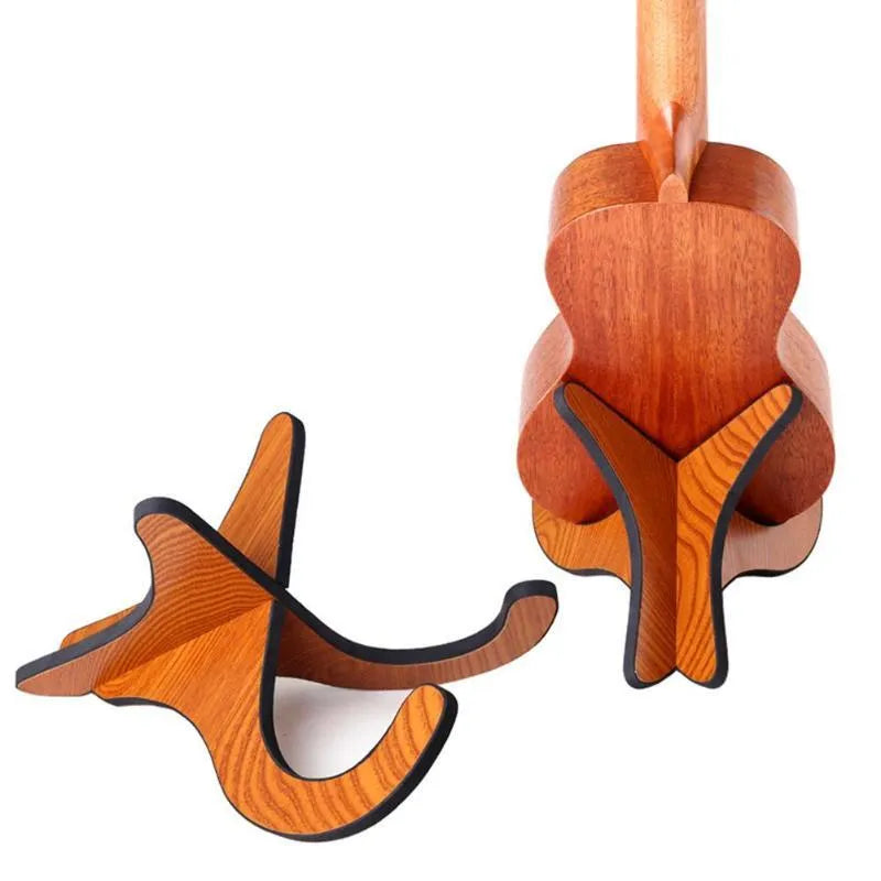 Wooden folding ukulele stand with EVA anti-slip foam holding a ukulele upright