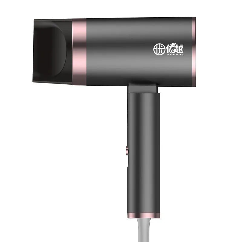 Foldable household hair dryer in emerald green with negative ion technology and four speed settings