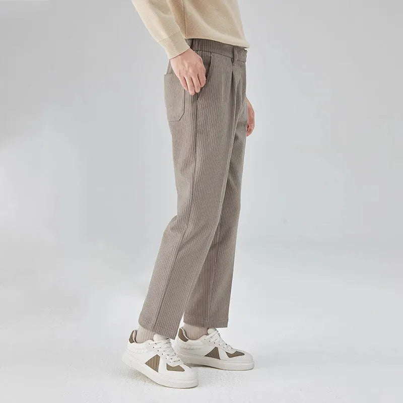 Men's straight-leg corduroy trousers in beige colour showing micro elastic waistband and loose fit design