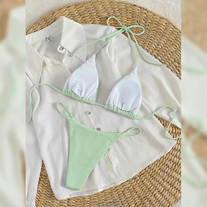 Women's lace up front tie bikini swimsuit on a hanger, showing adjustable detail and available in multiple colours.