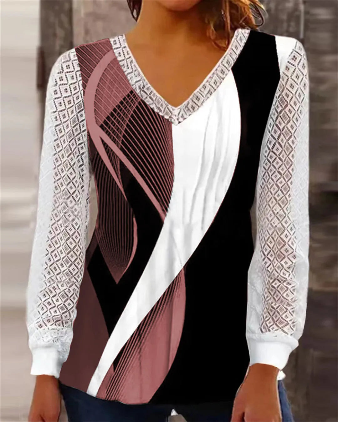 Purple women's loose V-neck top with hollow-out lace detailing on a hanger.