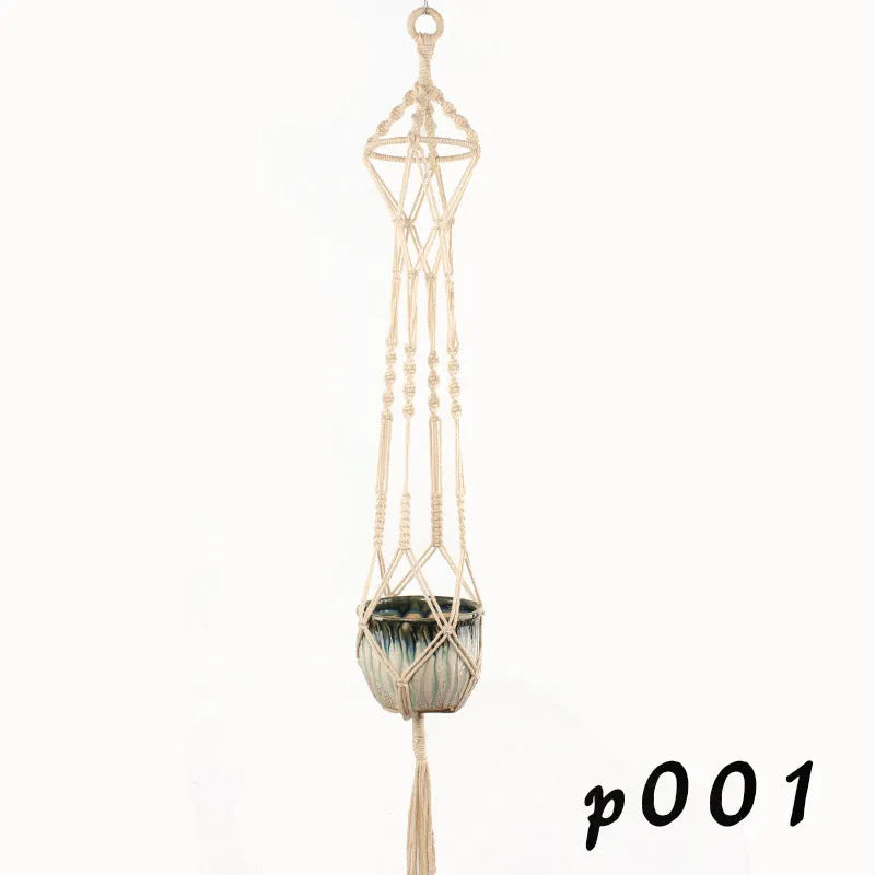 Woven wire plant hanger made from cotton rope in a desktop display style holding a small potted plant.
