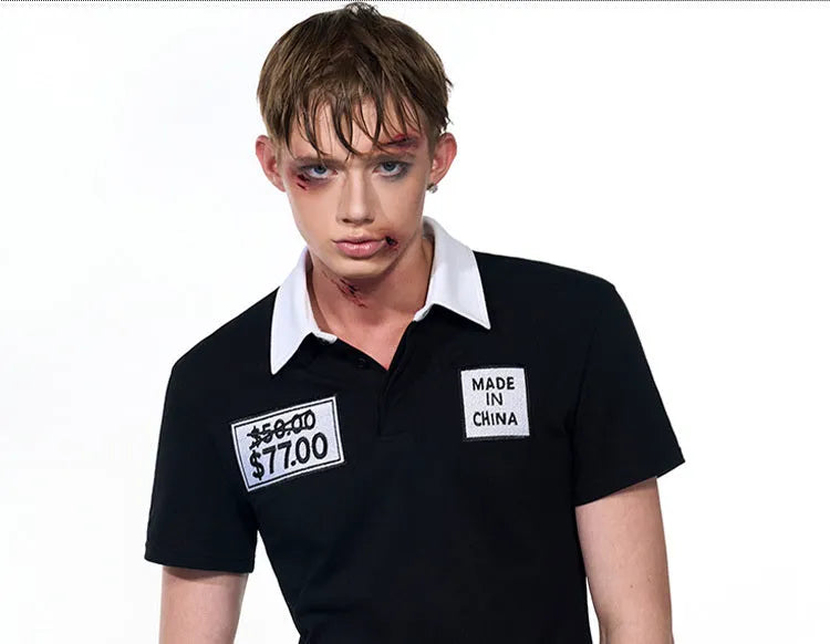 Black slim fit men's short sleeve polo shirt with an embroidered hat design on the front.