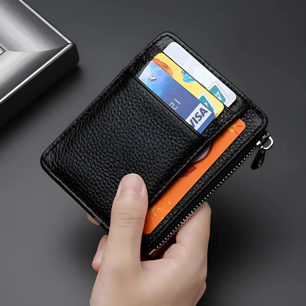 First layer cowhide leather card holder in solid colour with zipper closure on neutral background