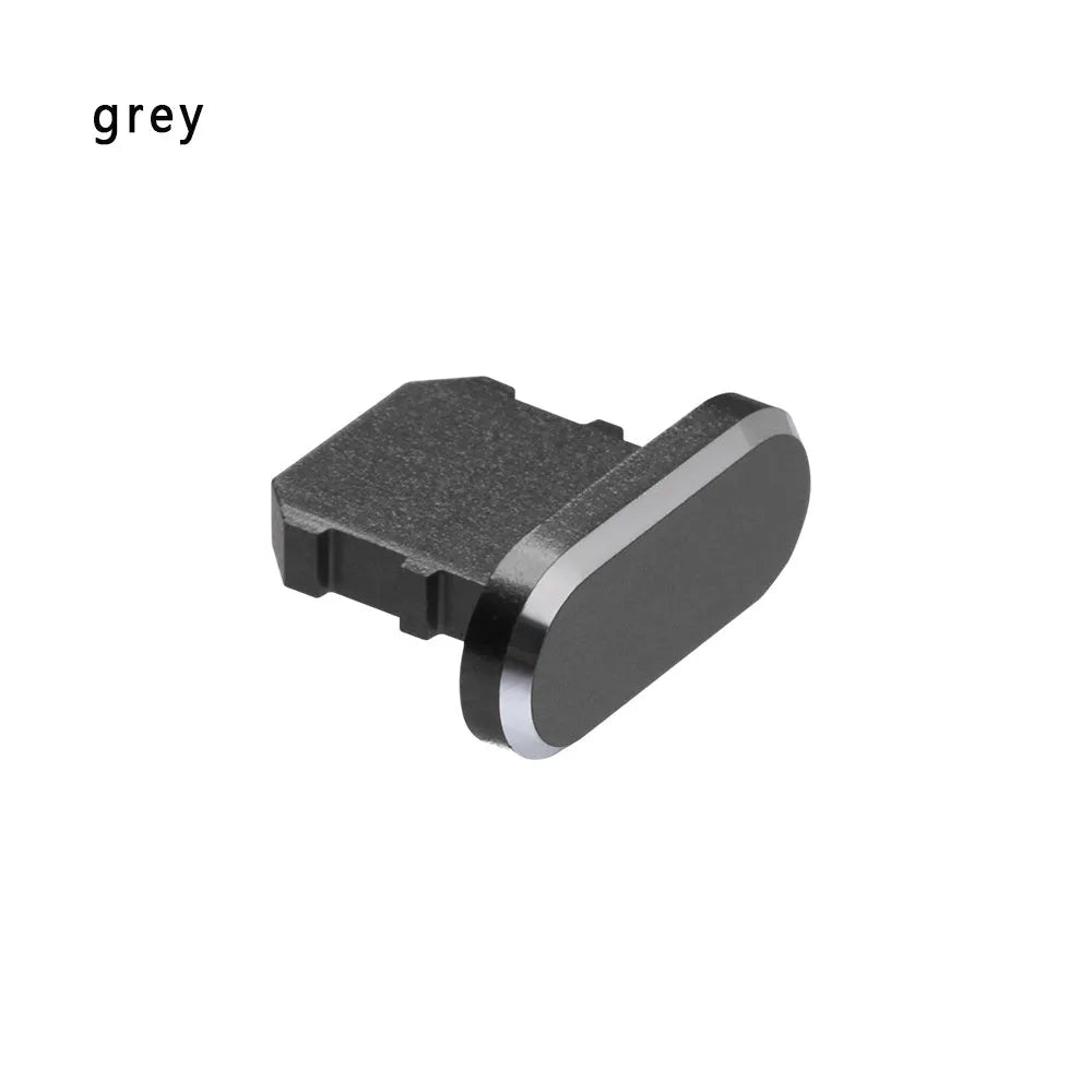 Aluminium alloy iPhone charging port dust plug in various colours on a white background.