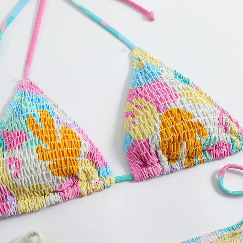 Multicolour floral printed women's triangle bikini with smocking craft details on the fabric.
