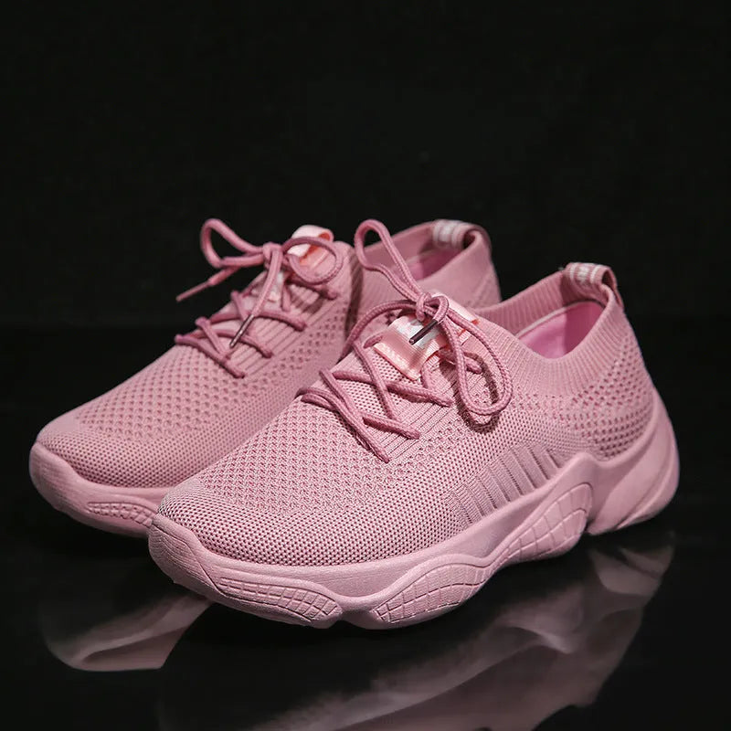 Women's white thick-soled sports shoe with woven upper and front strap