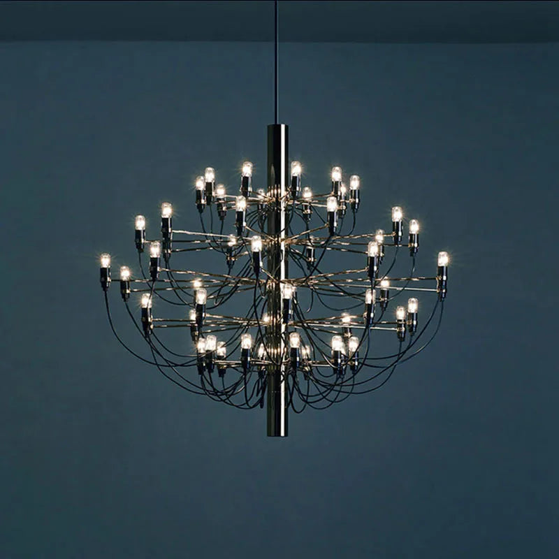 Modern three fork floor lamp with wooden stand and acrylic shade in a living room setting.
