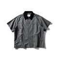Grey washed cotton short sleeve overall shirt on a hanger, loose fit.