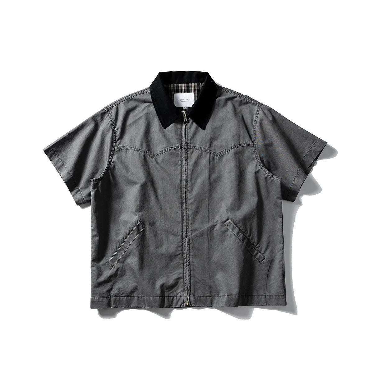 Grey washed cotton short sleeve overall shirt on a hanger, loose fit.