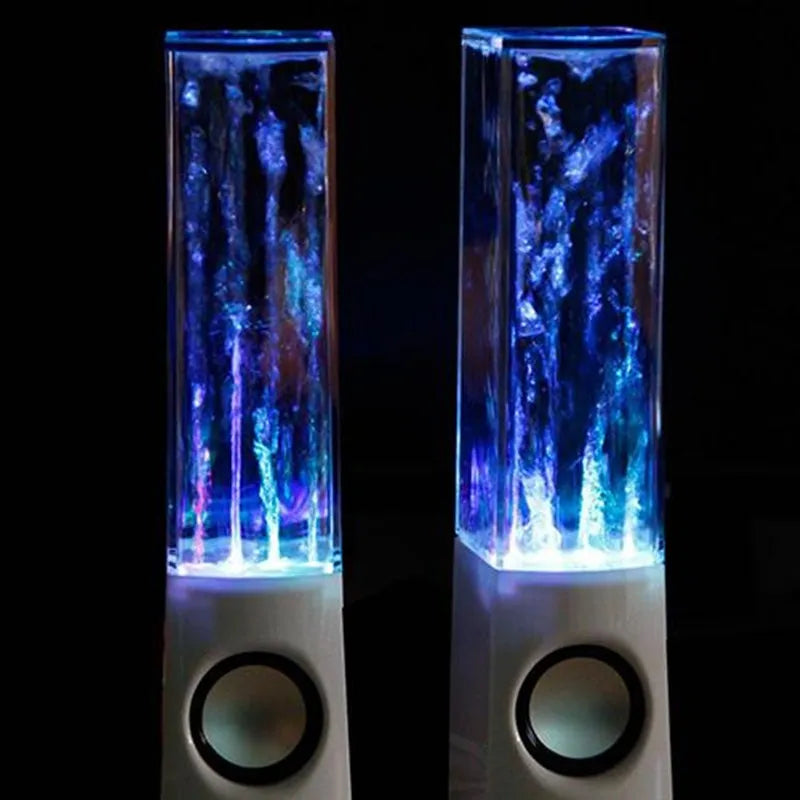 Wireless dancing water speaker with LED light fountain showing colourful water column and dual speakers on a desk