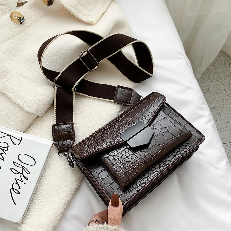 A PU fabric crossbody bag with an adjustable strap, shown in dark brown colour.