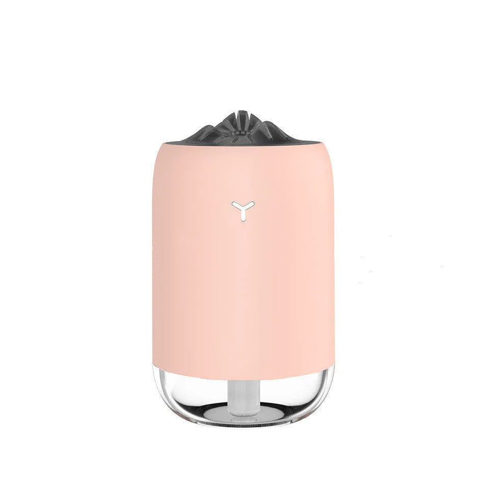 Mini USB ultrasonic humidifier 260ml with night light in turquoise green on a desk