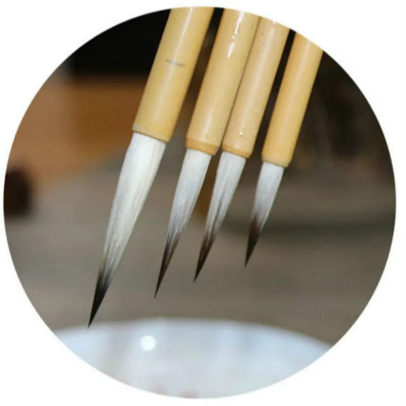 Four gold-body writing brushes with mixed-hair heads in pine branch colour set