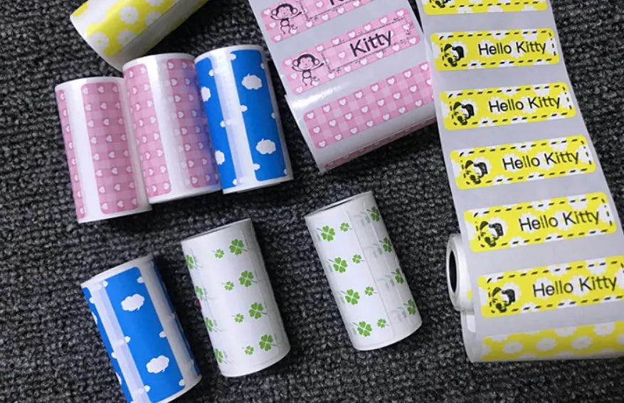 PerPage mini thermal printer paper rolls in regular, sticker, and label types with blue, pink, white, violet, and yellow options