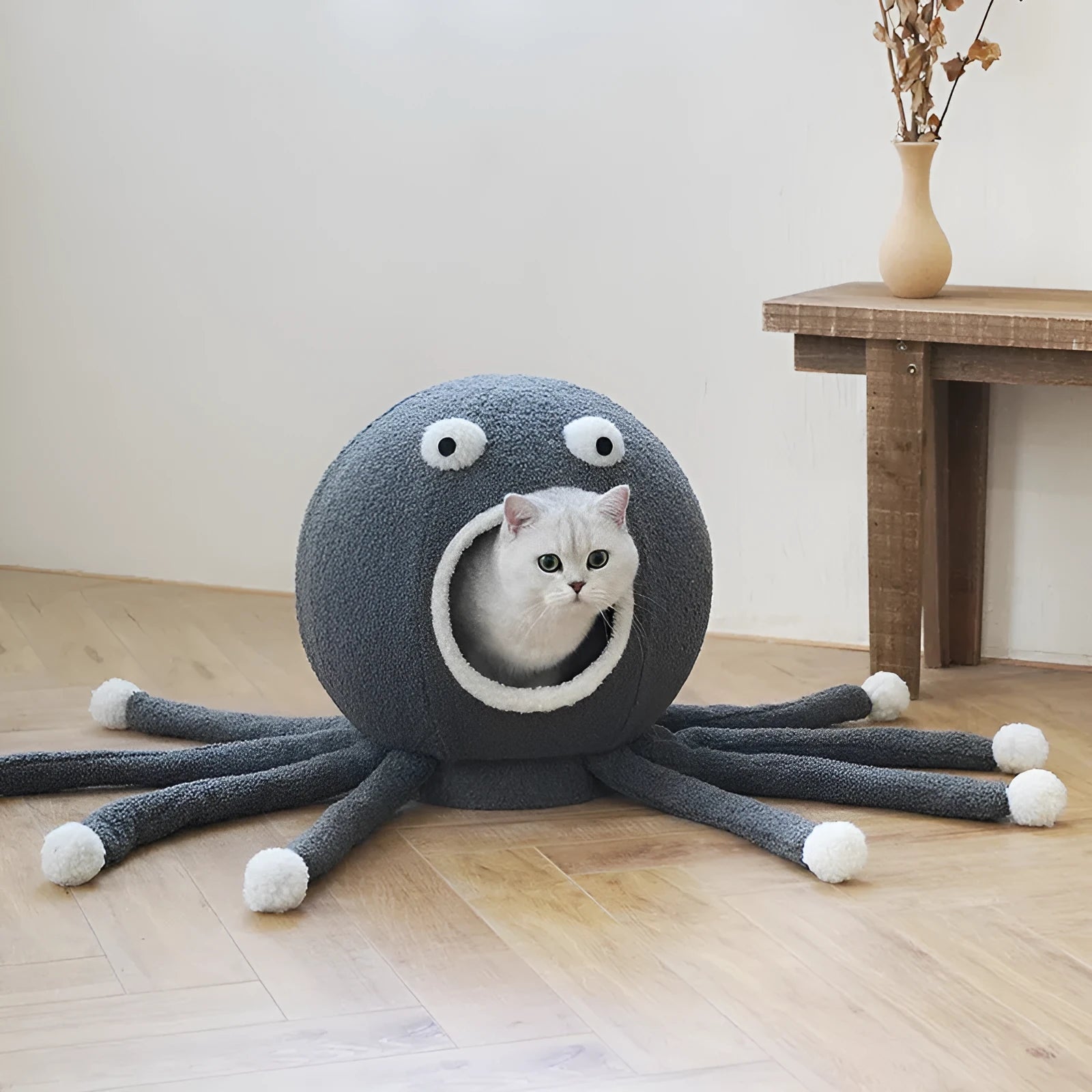 Plush octopus‑shaped cat nest in octopus colour, 40x40x42 cm, with raised eyes and soft cloth surface.