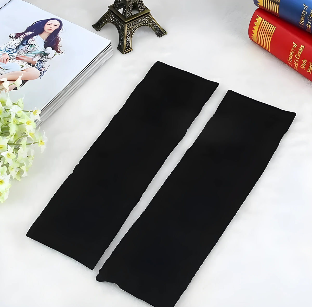 Pair of nylon leg shaping belt compression sleeves in black and skin colour, middle calf length, free size