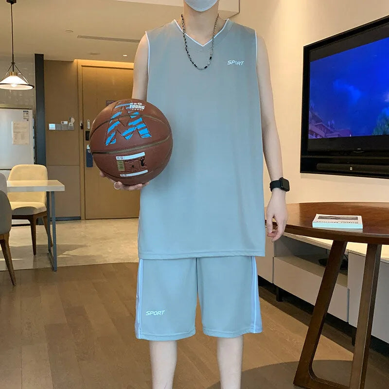 Polyester basketball sports suit with short sleeve vest and matching shorts in various colours