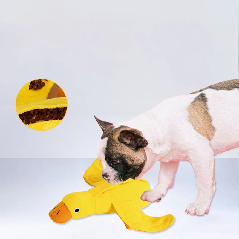 Yellow duck plush dog toy with squeaker and treat dispensing features