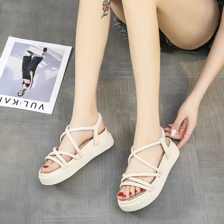 Women's black Roman style platform sandals with a round toe and sleeve design on a white background.