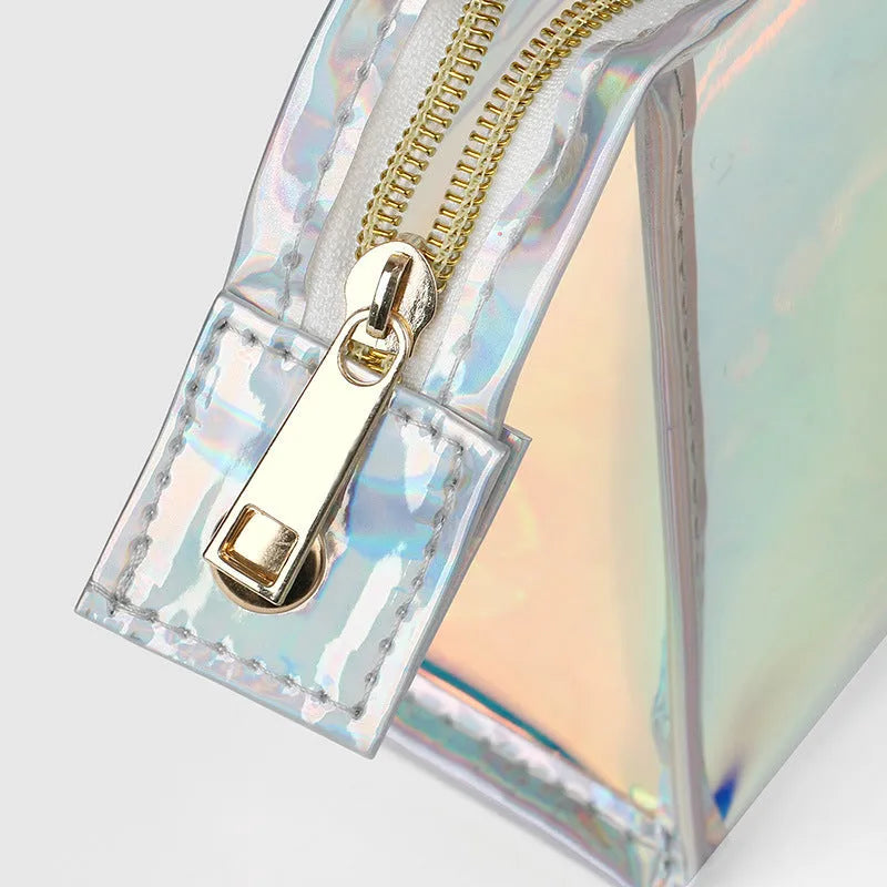 Transparent laser PVC cosmetic bag with zip closure, 22x7x14cm, on a flat surface