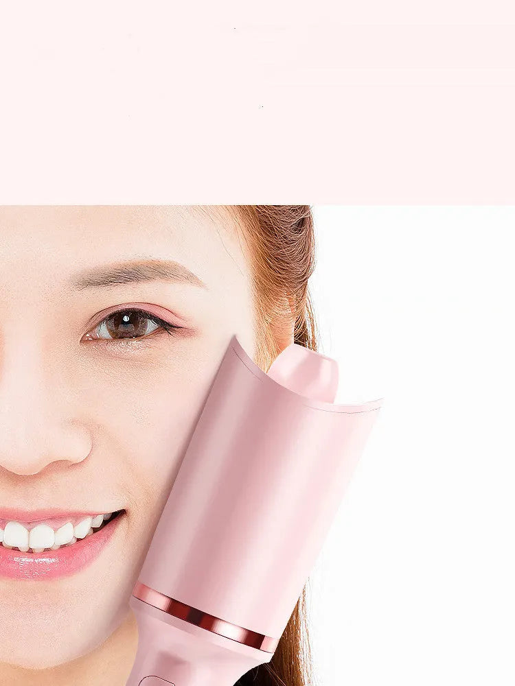 Electric rotating hair curler with tourmaline ceramic barrel in green, pink, and matte white on a neutral background