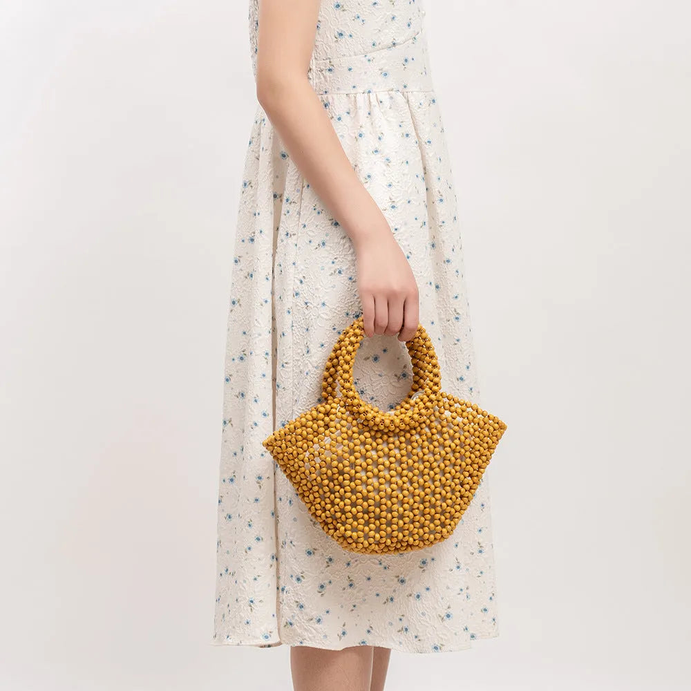 Hand-woven maple hollow handbag with wooden bead decoration, dumpling-shaped 13x7x18cm beach bag