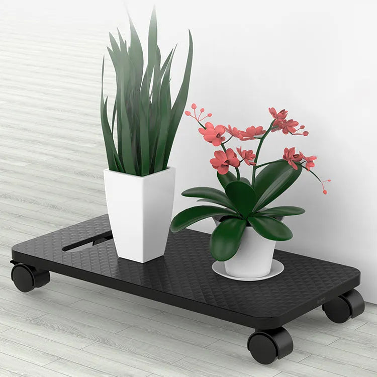Orico black CPU floor stand with wheels on wooden floor, holding a PC tower vertically