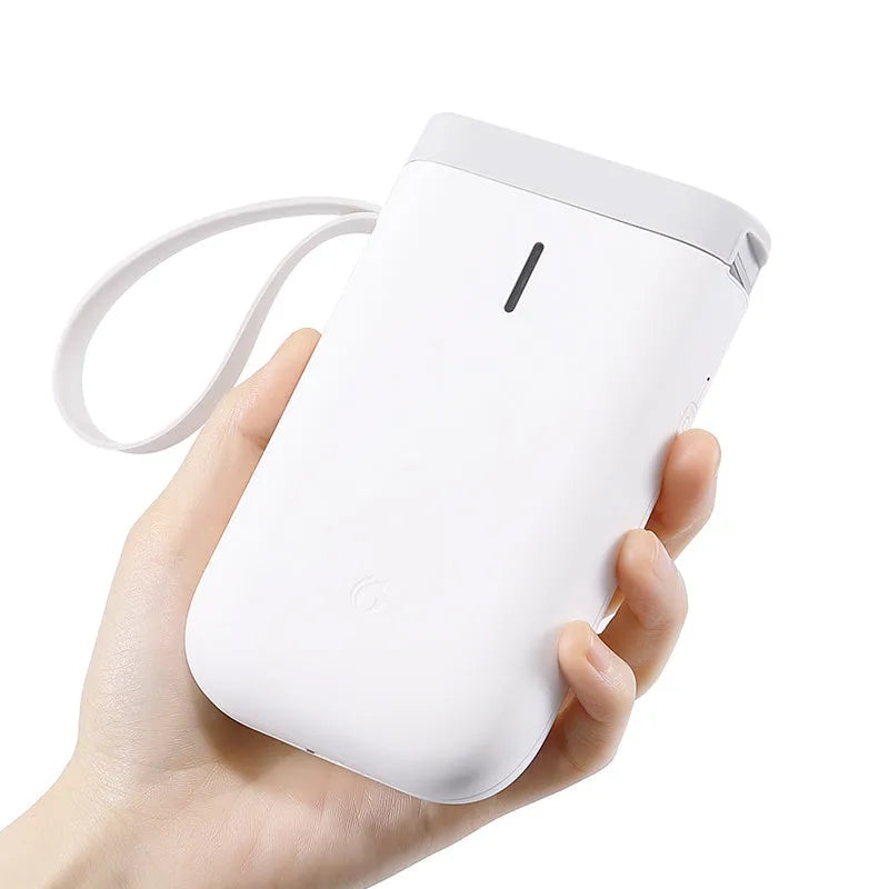 D11 Bluetooth label printer in black with thermal paper roll and smartphone showing app interface