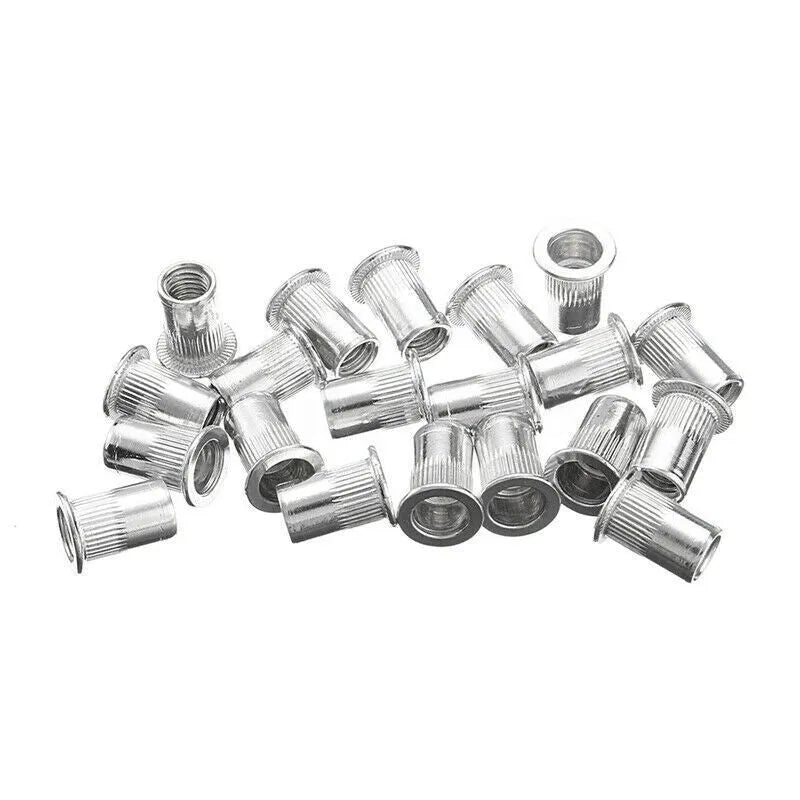 Alloy steel manual riveter tool with a selection of nut rivet fasteners from the kit.