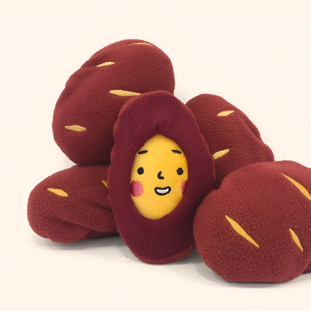 Red sweet potato shaped dog puzzle toy with hidden treat compartments