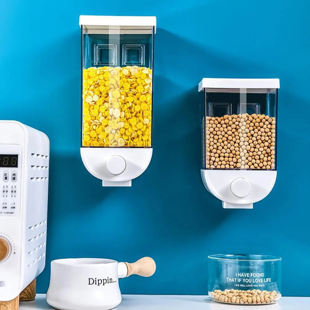 White wall-mounted transparent kitchen food storage container with easy-press cereal dispenser lid.
