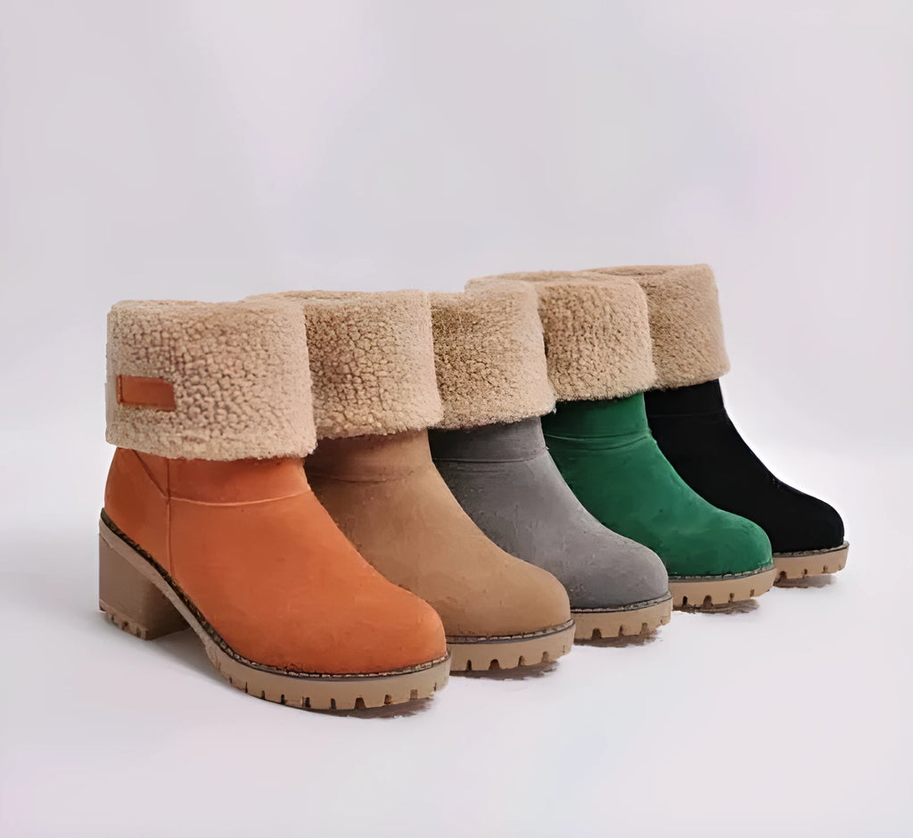 Women's mid-calf suede snow boots with a low flat heel and round toe in various colours.