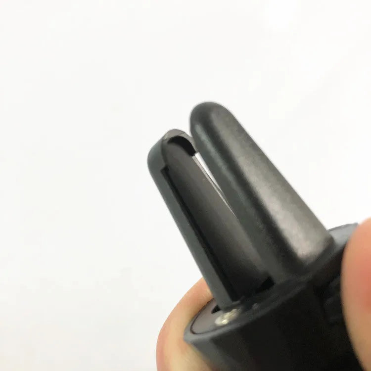 Glossy black car air vent phone holder with adjustable clamping mechanism