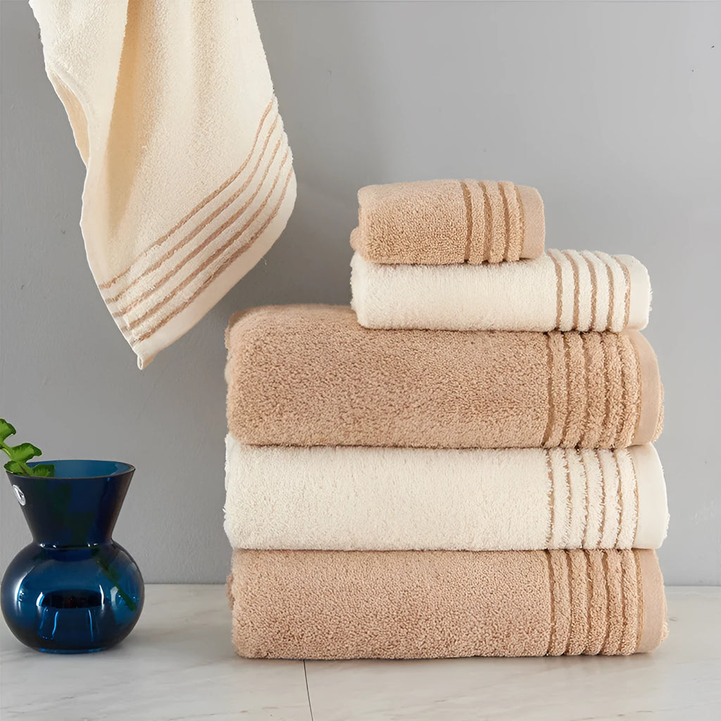 Cotton towels set showing bath, hand and guest towels in brown colour