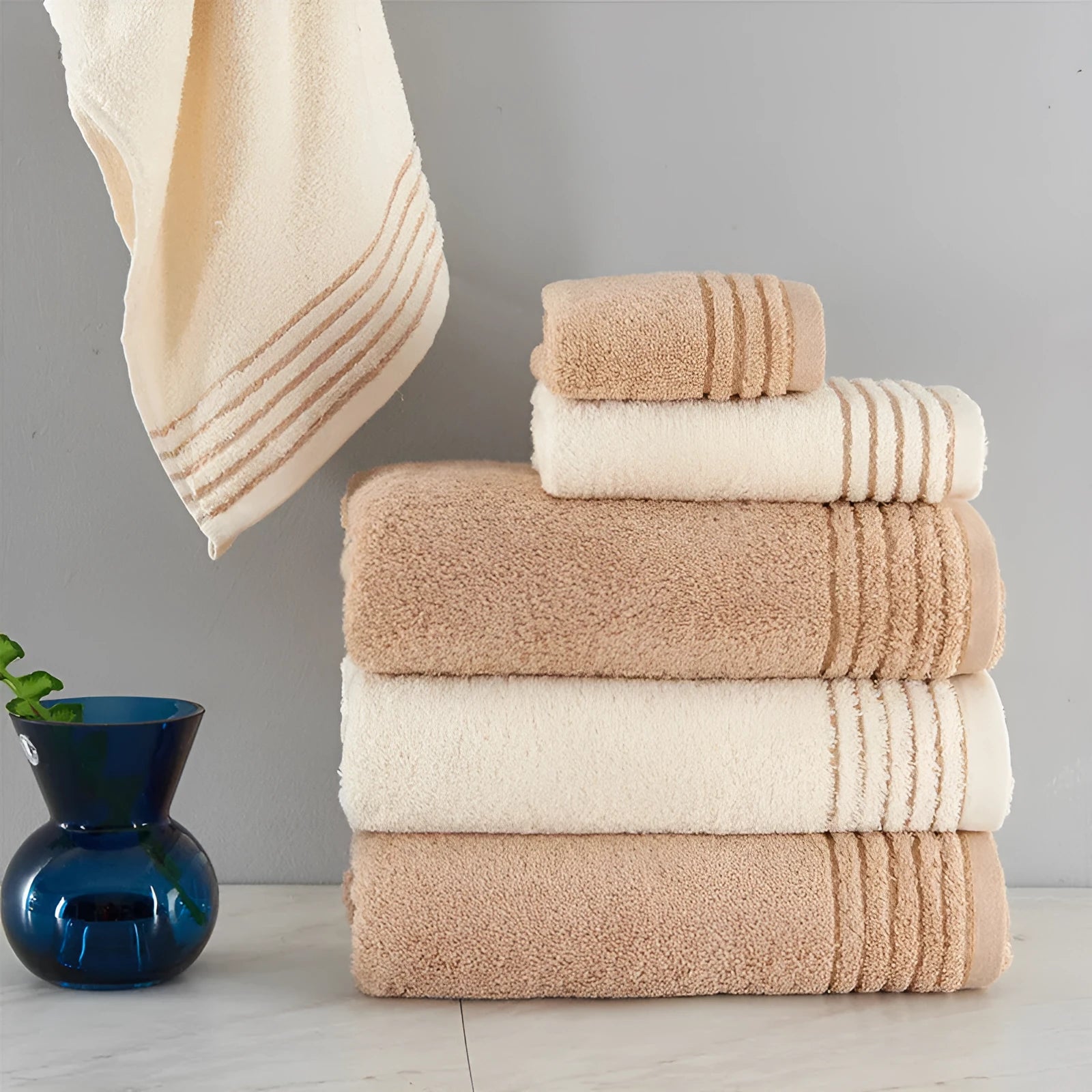 Cotton towels set showing bath, hand and guest towels in brown colour