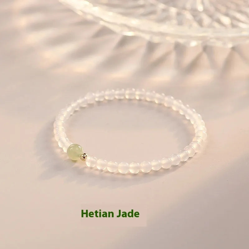 Natural white agate women's bracelet on wrist showing handmade beads and 15cm length.