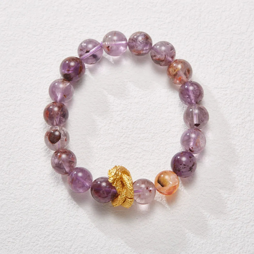 Purple cornucopia nine purple good luck crystal bracelet with zodiac animal motifs on wrist