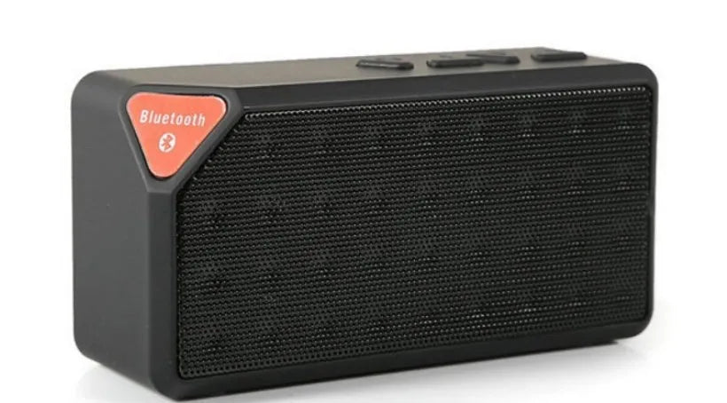 Cannon X3 small cube-shaped wireless Bluetooth speaker in chosen colour on a surface