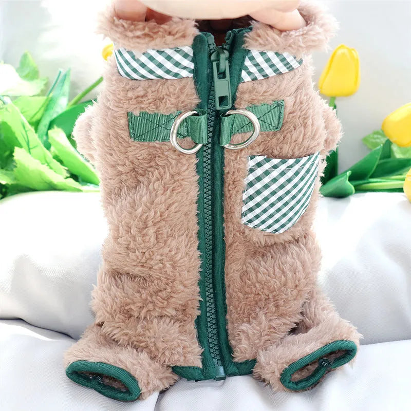 Small dog wearing green fleece coat with back zipper and D-rings, four-legged jumpsuit style