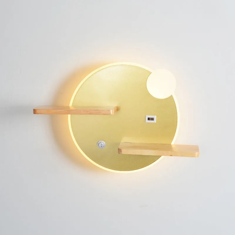 Black round bedside lamp with USB charging port on a wooden nightstand.