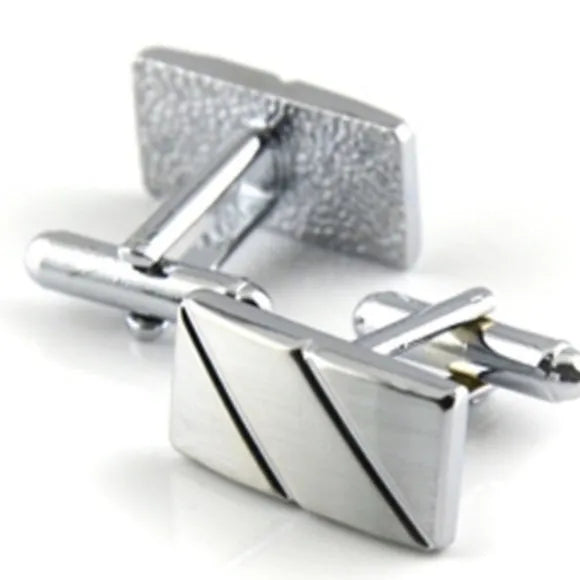 Silver diagonal alloy cufflinks with K9 crystal and matching tie clip on a white background