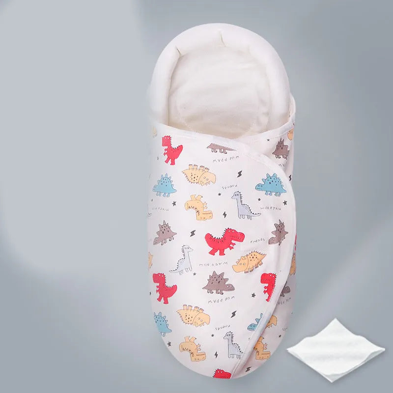 Cotton baby anti startle swaddle measuring 30 by 60 centimetres in a colourful print design.