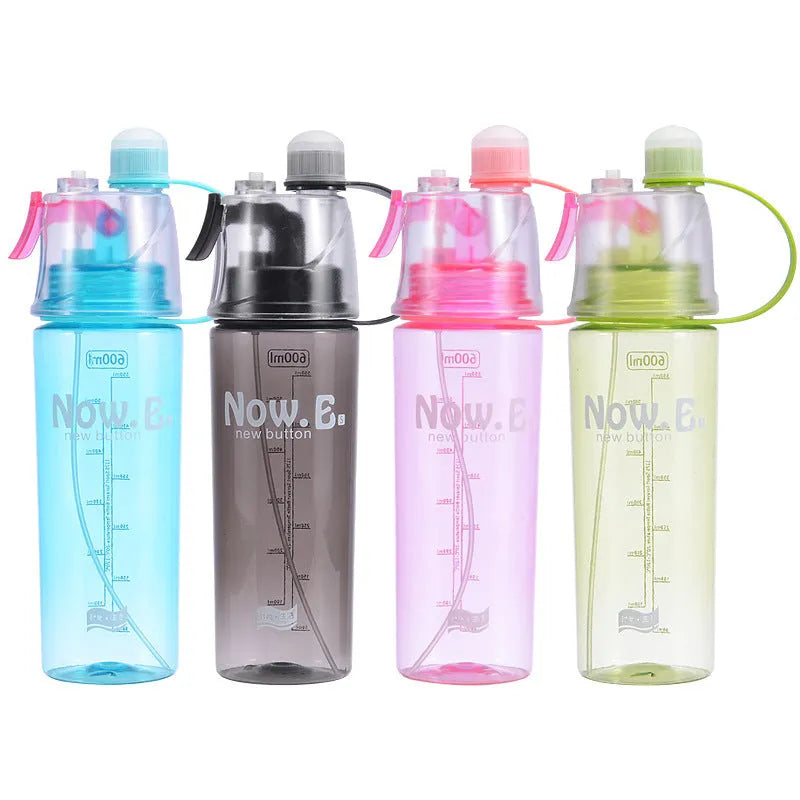 Green portable sports mist spray cup with transparent body, volume scale, handle, and spray mouth.